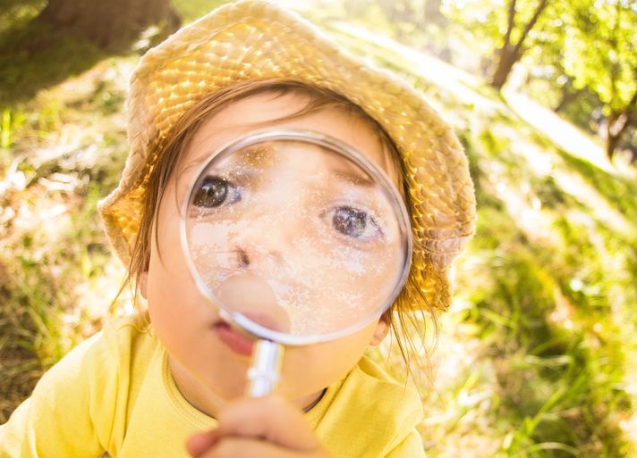 funny-curious-toddler-holding-magnifying-glass-up-royalty-free-image-470643142-1558005124